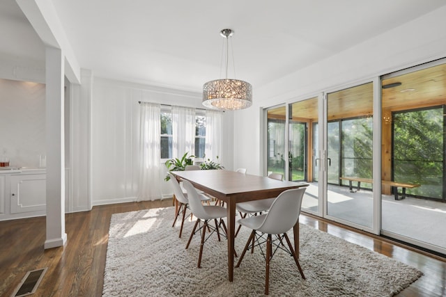 187 Thornbury Rd, Scarsdale, NY 10583 - dining room with dark wood-style flooring and a chandelier