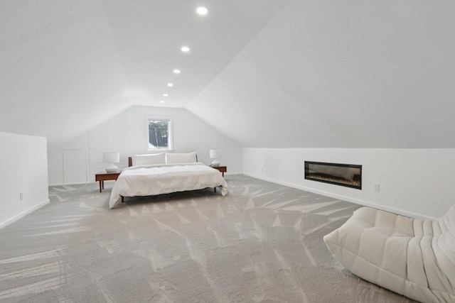 187 Thornbury Rd, Scarsdale, NY 10583 - carpeted bedroom featuring lofted ceiling, recessed lighting, and a glass covered fireplace