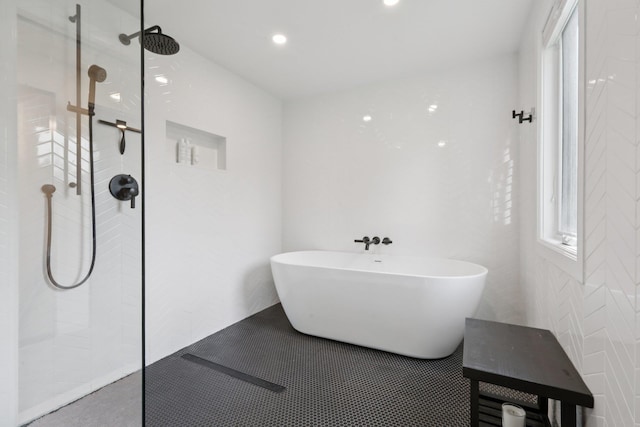 187 Thornbury Rd, Scarsdale, NY 10583 - bathroom with plenty of natural light, walk in shower, a freestanding bath, and recessed lighting