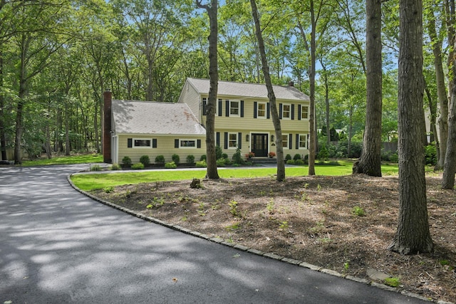 131 Long Pond Rd, Wading River, NY 11792 - colonial home with a chimney
