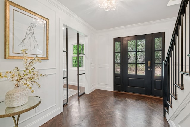 131 Long Pond Rd, Wading River, NY 11792 - foyer entrance with crown molding, stairway, a decorative wall, and a chandelier