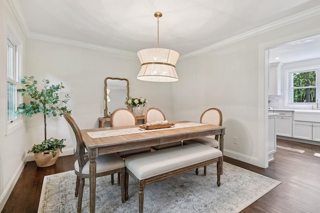 131 Long Pond Rd, Wading River, NY 11792 - dining area with dark wood-style flooring and ornamental molding