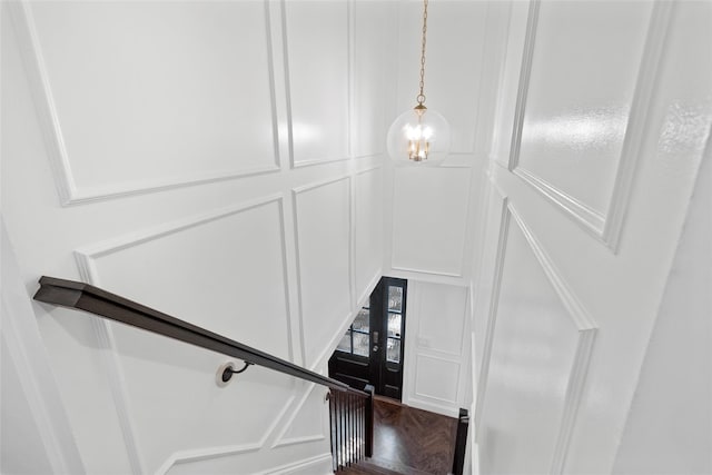 131 Long Pond Rd, Wading River, NY 11792 - staircase with a decorative wall and a chandelier