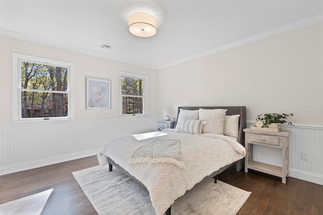 131 Long Pond Rd, Wading River, NY 11792 - bedroom with a wainscoted wall, dark wood-type flooring, and ornamental molding