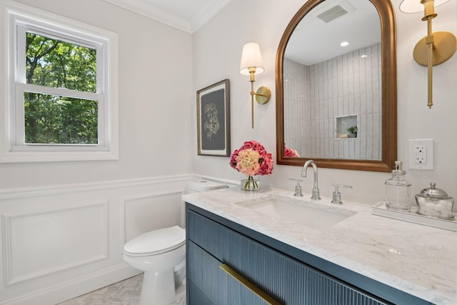 131 Long Pond Rd, Wading River, NY 11792 - bathroom featuring vanity, ornamental molding, a decorative wall, and a wainscoted wall