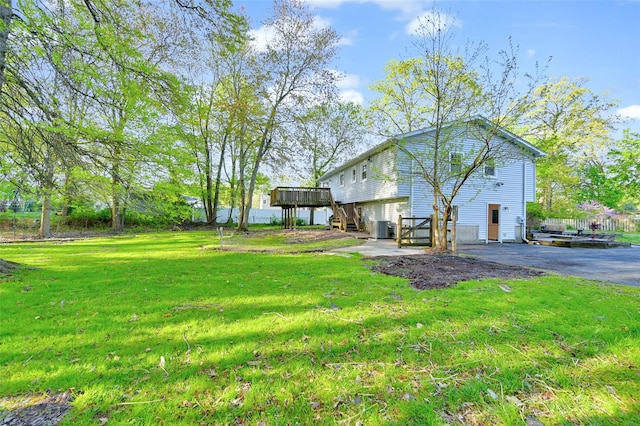 23 White Oak Ln, Bardonia, NY 10954 - view of side of property featuring a wooden deck, a lawn, driveway, and stairs