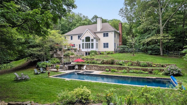 4 Hidden Valley Way, Bedford, NY 10506 - rear view of house featuring a chimney, a fenced backyard, and an outdoor pool