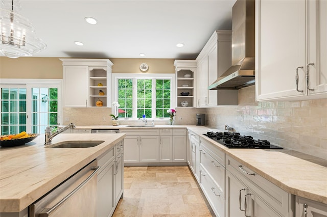 4 Hidden Valley Way, Bedford, NY 10506 - kitchen featuring wall chimney exhaust hood, open shelves, stainless steel dishwasher, black gas cooktop, and plenty of natural light