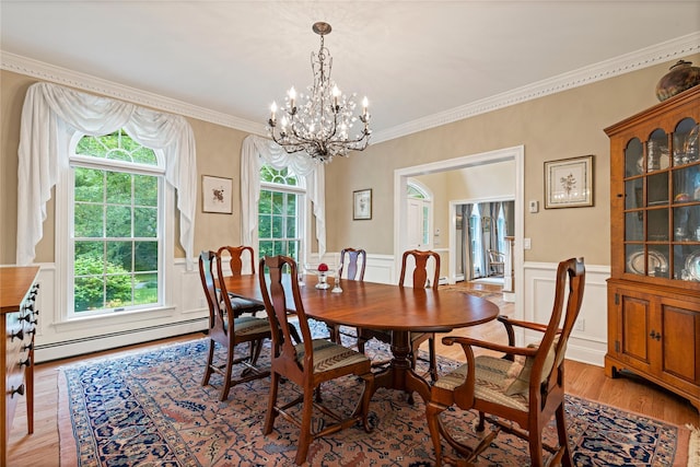 4 Hidden Valley Way, Bedford, NY 10506 - dining room with a baseboard heating unit, light wood-style flooring, a chandelier, a wainscoted wall, and ornamental molding