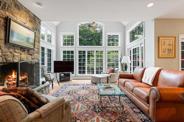 4 Hidden Valley Way, Bedford, NY 10506 - living area featuring ceiling fan, a fireplace, baseboard heating, wood finished floors, and high vaulted ceiling