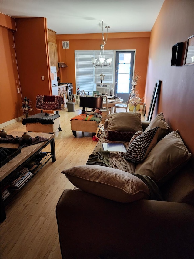 35-11 85th St Unit 1B, Jackson Heights, NY 11372 - living room featuring wood finished floors and a chandelier