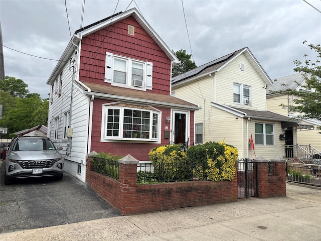 10418 216th St, Queens Village, NY 11429 - view of front of house with a fenced front yard and a gate