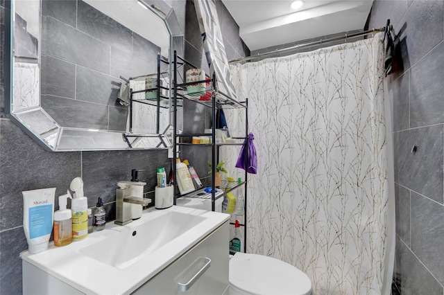 14431 166th St, Jamaica, NY 11434 - bathroom with tile walls, vanity, and curtained shower