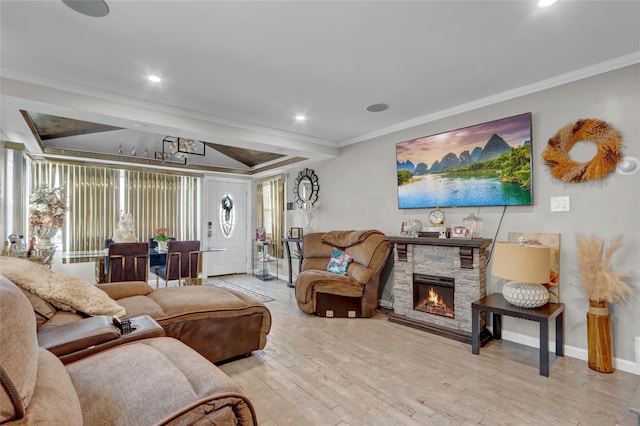 14431 166th St, Jamaica, NY 11434 - living area with ornamental molding, wood finished floors, a fireplace, recessed lighting, and a raised ceiling