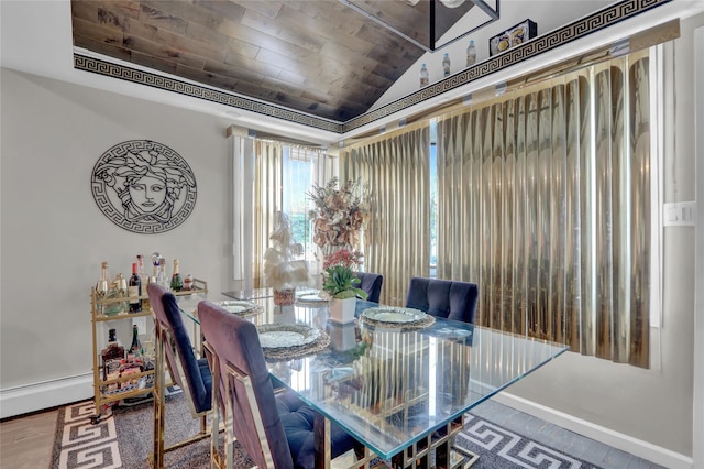 14431 166th St, Jamaica, NY 11434 - dining area featuring lofted ceiling, wooden ceiling, and a baseboard heating unit