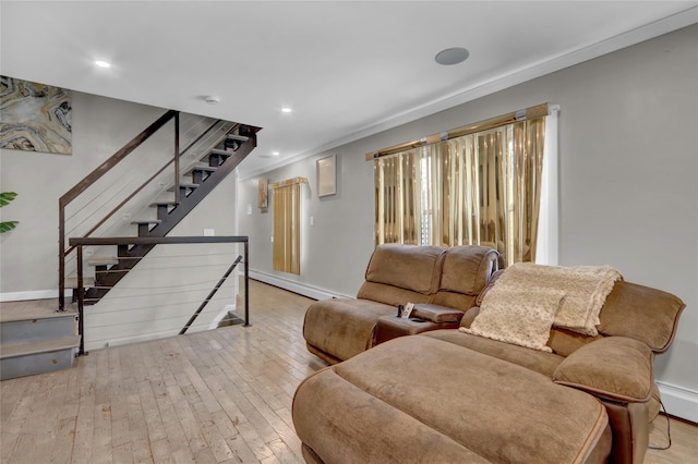 14431 166th St, Jamaica, NY 11434 - living area featuring baseboard heating, wood-type flooring, ornamental molding, recessed lighting, and stairway