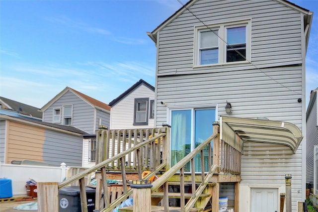 14431 166th St, Jamaica, NY 11434 - rear view of property featuring a wooden deck and stairway
