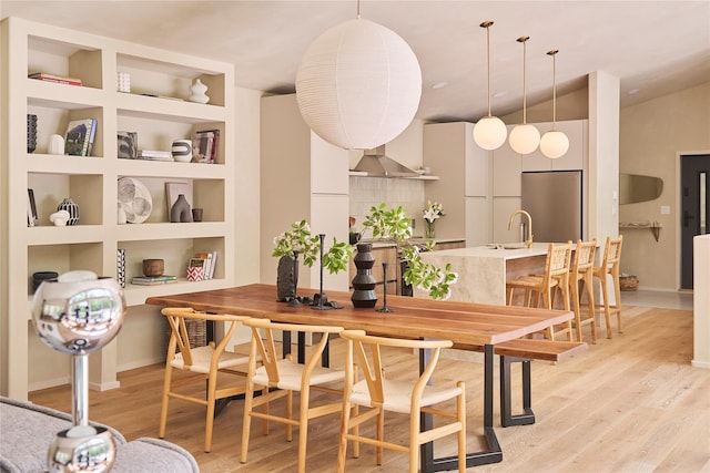 252 Swamp Pond Rd, Narrowsburg, NY 12764 - dining room featuring light wood finished floors and vaulted ceiling