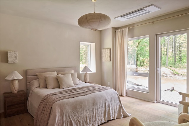 252 Swamp Pond Rd, Narrowsburg, NY 12764 - bedroom featuring access to outside and light wood-style flooring