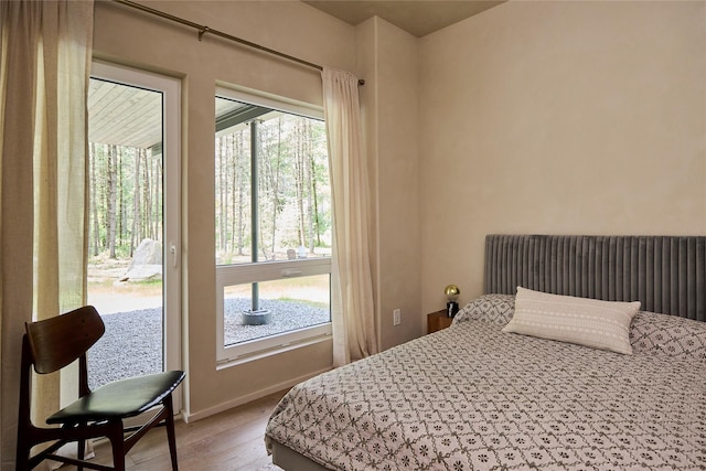 252 Swamp Pond Rd, Narrowsburg, NY 12764 - bedroom with access to exterior and light wood-type flooring