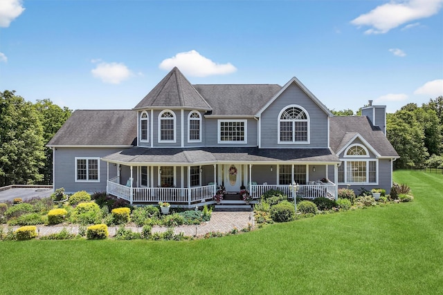 40 Rapelje Rd, Walden, NY 12586 - victorian house with a chimney, a front lawn, and covered porch