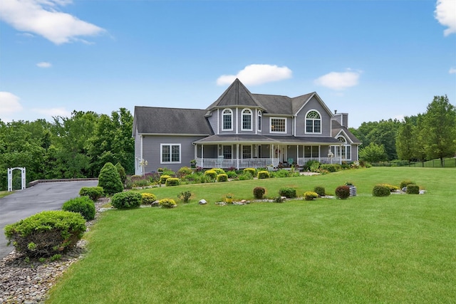 40 Rapelje Rd, Walden, NY 12586 - victorian home with a porch, a front yard, and a chimney