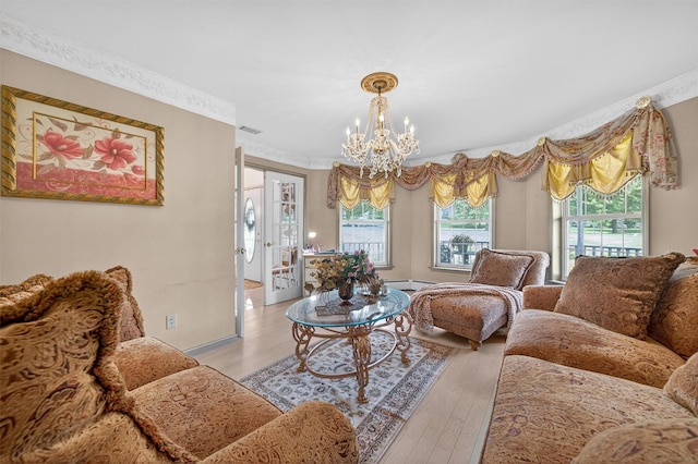 40 Rapelje Rd, Walden, NY 12586 - living room featuring light wood finished floors, a chandelier, and crown molding
