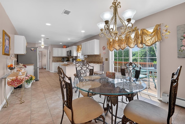 40 Rapelje Rd, Walden, NY 12586 - dining space with light tile patterned floors, a chandelier, recessed lighting, and baseboard heating