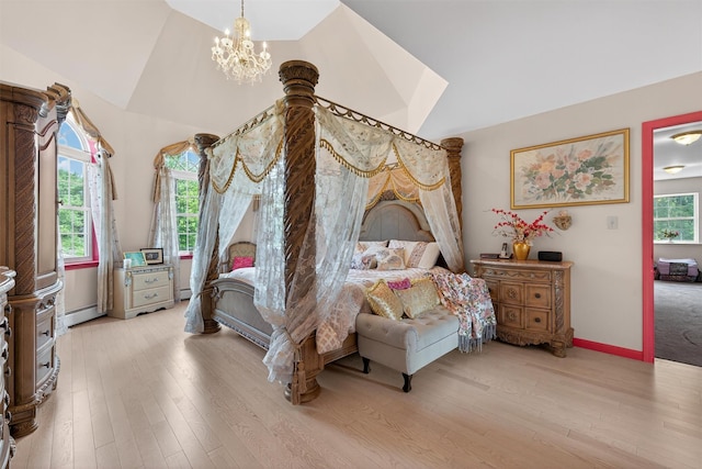 40 Rapelje Rd, Walden, NY 12586 - bedroom featuring a baseboard heating unit, a chandelier, lofted ceiling, and light wood-style floors