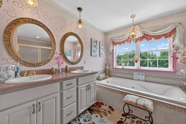 40 Rapelje Rd, Walden, NY 12586 - full bathroom featuring double vanity, a whirlpool tub, tile patterned flooring, a chandelier, and wallpapered walls