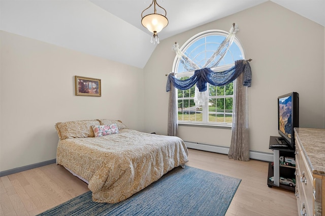 40 Rapelje Rd, Walden, NY 12586 - bedroom with vaulted ceiling, light wood-style floors, and a baseboard heating unit
