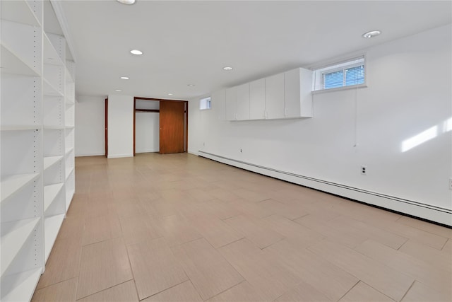 33 Park Cir, New Hyde Park, NY 11040 - basement with a baseboard heating unit and recessed lighting