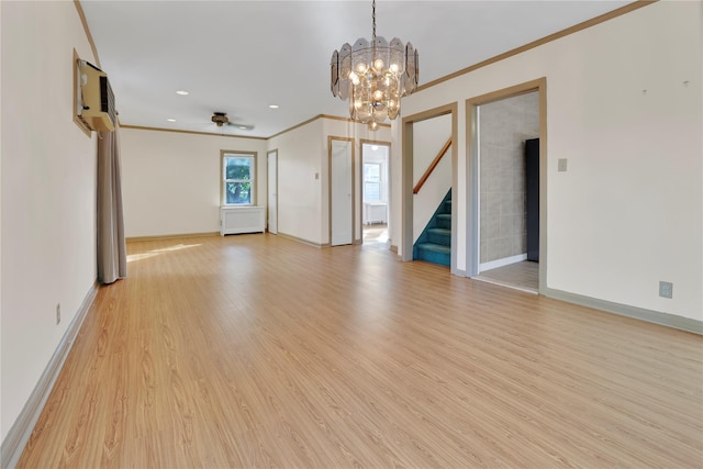 33 Park Cir, New Hyde Park, NY 11040 - unfurnished living room featuring ornamental molding, stairs, light wood-style floors, a chandelier, and ceiling fan
