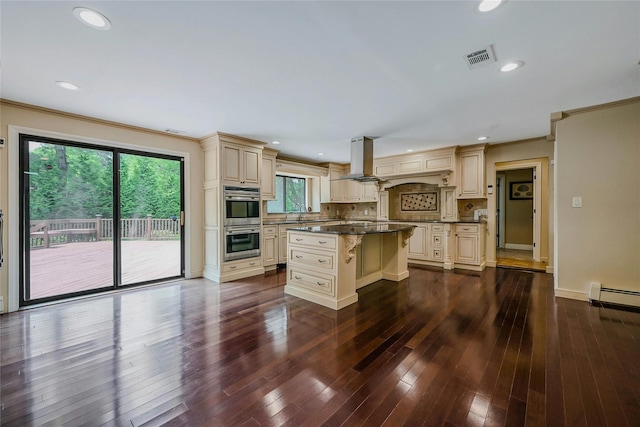 160 Coachman Pl E, Syosset, NY 11791 - kitchen featuring cream cabinetry, double oven, island range hood, a center island, and recessed lighting