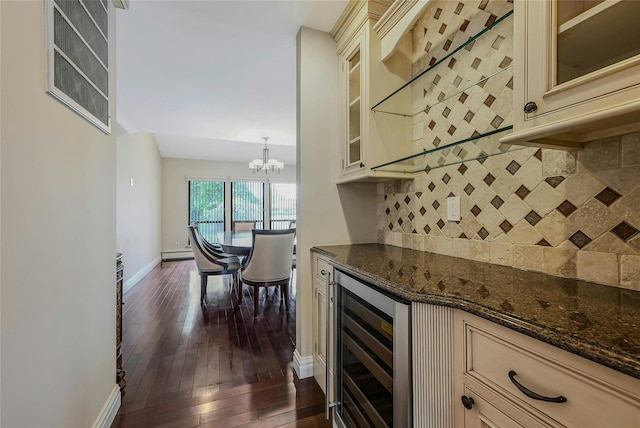 160 Coachman Pl E, Syosset, NY 11791 - kitchen with cream cabinetry, beverage cooler, dark wood-type flooring, and dark stone countertops