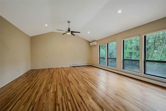 160 Coachman Pl E, Syosset, NY 11791 - empty room with an AC wall unit, light wood-style flooring, plenty of natural light, ceiling fan, and vaulted ceiling