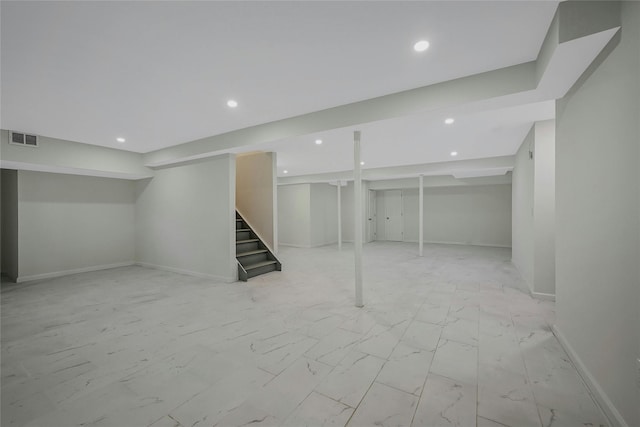 160 Coachman Pl E, Syosset, NY 11791 - finished basement with stairway, recessed lighting, and light marble finish floors