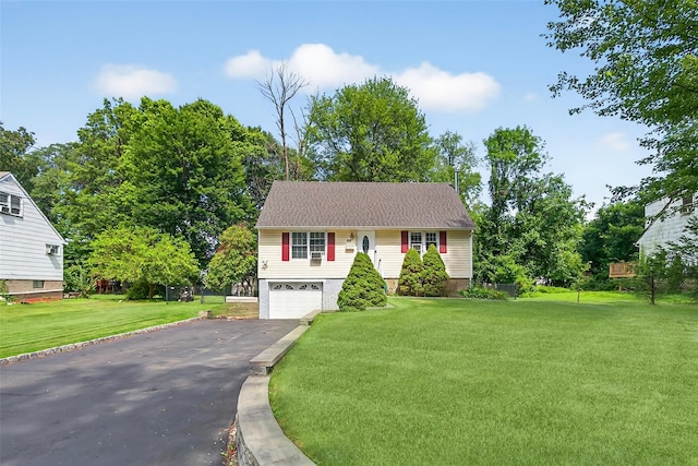 60 Freedman Ave, Nanuet, NY 10954 - view of front of home featuring asphalt driveway, a front yard, and a garage
