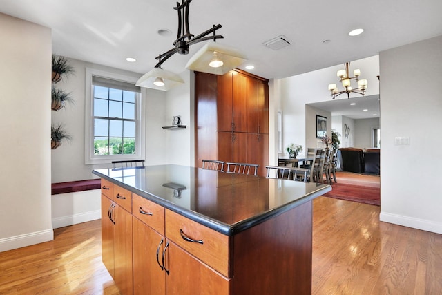 2 Harbor Ln Unit 301, New Rochelle, NY 10805 - kitchen with dark countertops, light wood finished floors, a chandelier, a kitchen island, and recessed lighting