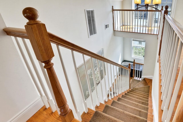 2 Harbor Ln Unit 301, New Rochelle, NY 10805 - stairs with a chandelier, a towering ceiling, and wood finished floors