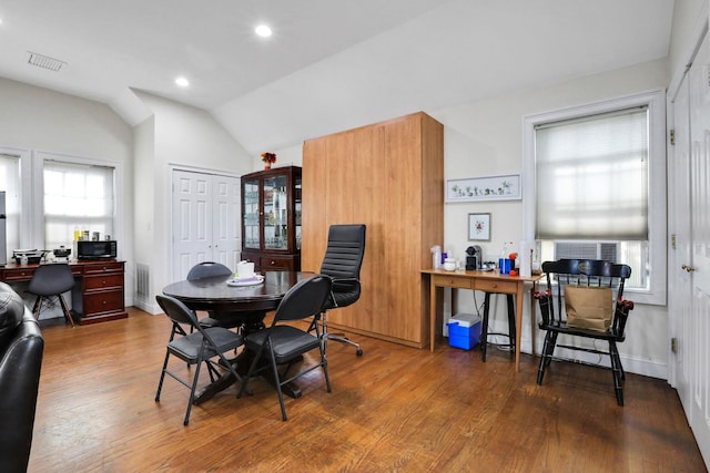 2 Harbor Ln Unit 301, New Rochelle, NY 10805 - dining space featuring an office area, wood finished floors, vaulted ceiling, and recessed lighting