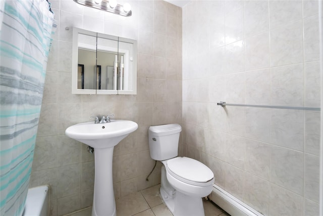 2370 Atlantic Ave, Brooklyn, NY 11233 - full bath with tile walls, tile patterned flooring, a baseboard heating unit, and shower / tub combo with curtain