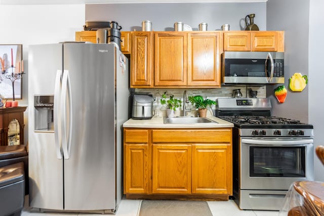 2370 Atlantic Ave, Brooklyn, NY 11233 - kitchen with stainless steel appliances, decorative backsplash, light countertops, and brown cabinets