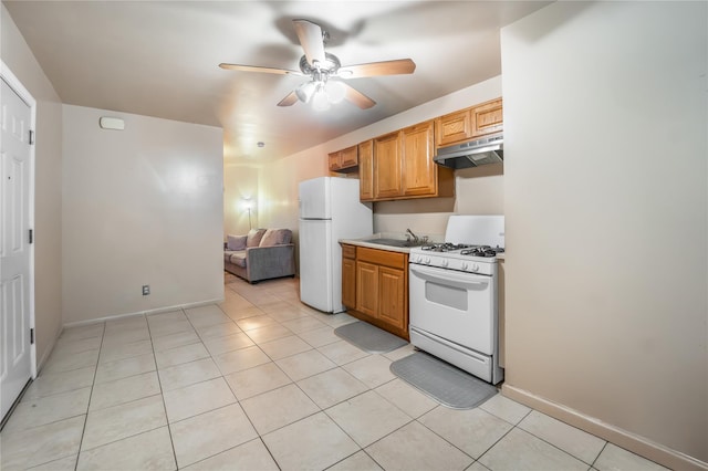 2370 Atlantic Ave, Brooklyn, NY 11233 - kitchen with white appliances, under cabinet range hood, a ceiling fan, and light tile patterned floors