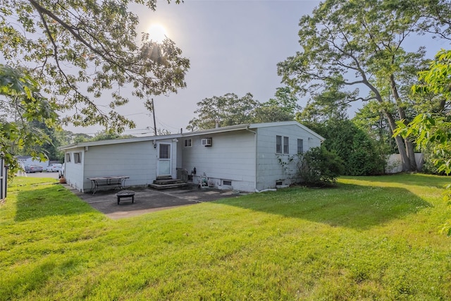 10 Jan Ct, Ronkonkoma, NY 11779 - back of house with entry steps, a patio area, a lawn, and an AC wall unit
