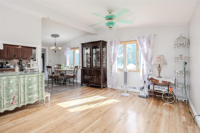 10 Jan Ct, Ronkonkoma, NY 11779 - entrance foyer featuring a ceiling fan, light wood-style floors, and a chandelier