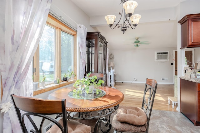 10 Jan Ct, Ronkonkoma, NY 11779 - dining space featuring a chandelier, a wall mounted air conditioner, and ceiling fan