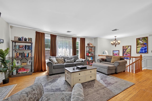 60 Palomino Pl, New Windsor, NY 12553 - living room with a chandelier and light wood-type flooring