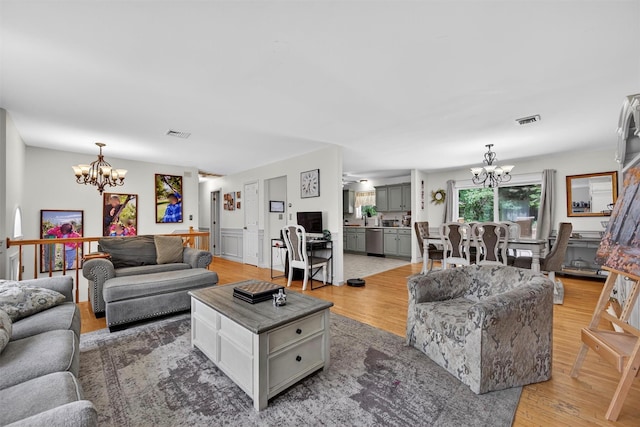 60 Palomino Pl, New Windsor, NY 12553 - living area featuring a chandelier and light wood-style floors