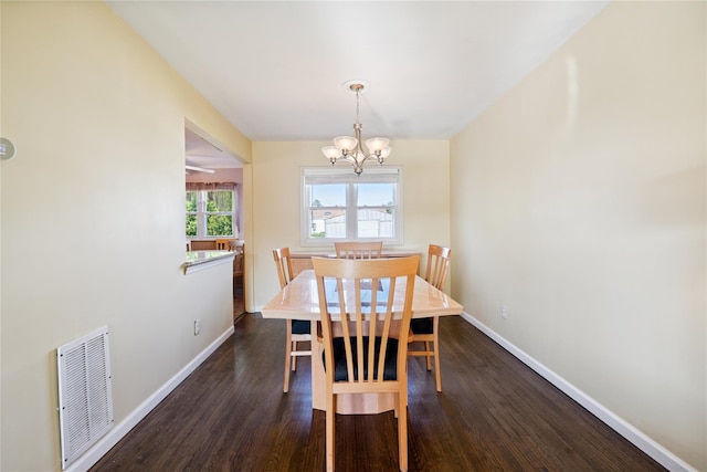 343 W 16th St, Deer Park, NY 11729 - dining room with a chandelier and dark wood-style flooring